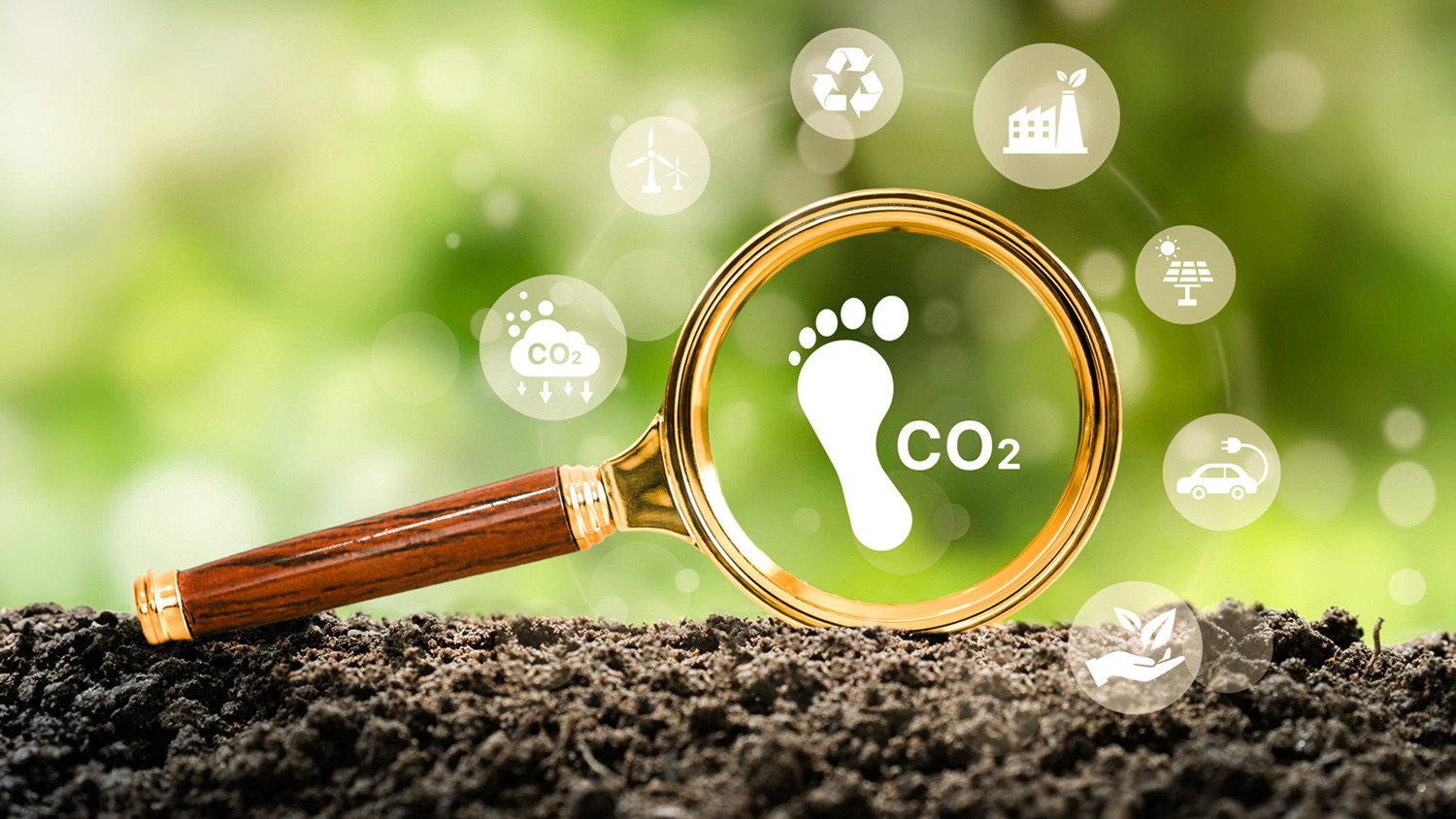 Lupe mit CO2 und Fußabdruck Symbol